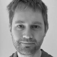 Headshot of Dr. Benjamin Evans in grayscale.