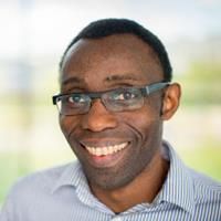 Lekan Daramola. Credit: Lekan Daramola Headshot of Lekan Daramola. Lekan is wearing a striped shirt and is smiling at the camera.