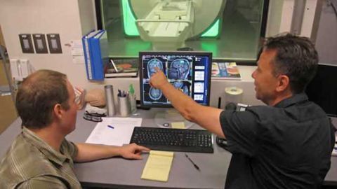 Signs of pure altruism converge in the brain and increase with age