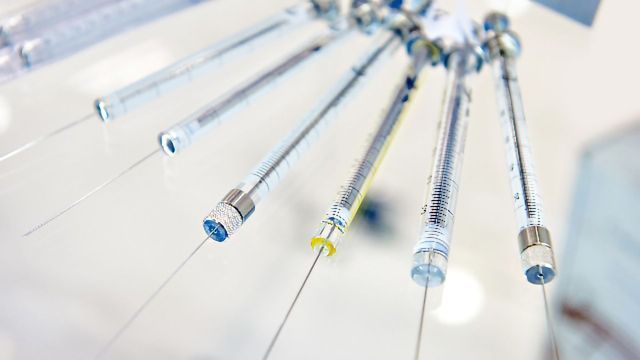 Gas chromatography injection needles pointing downwards. 