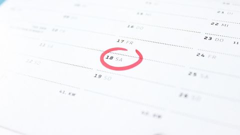 Calendar page with the date a period started circled in red.
