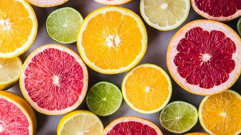 Cut-side-up halved citrus fruits.