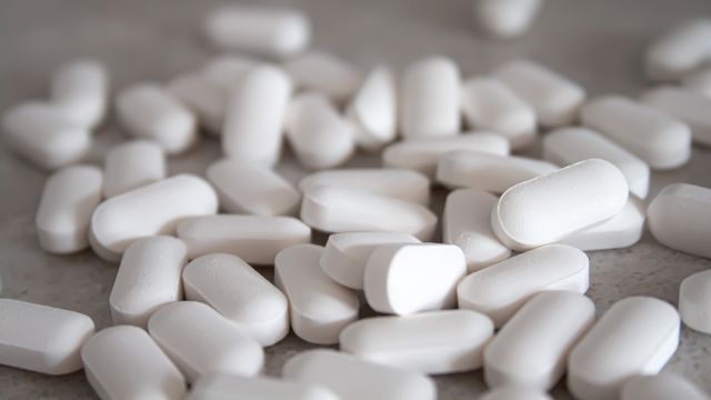 White tablets on a grey surface. 