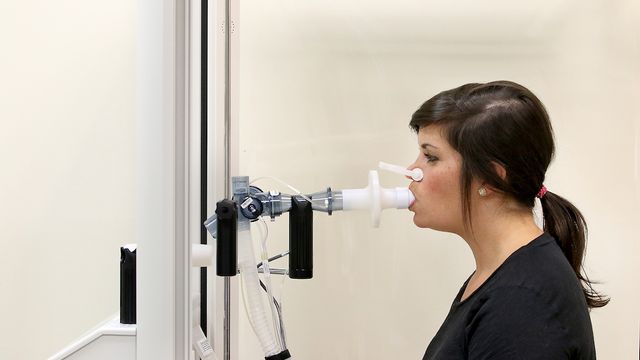 A study coordinator demonstrating how to carry out lung function testing. 