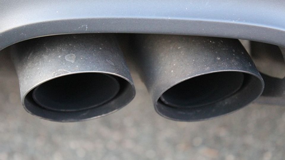 Two exhaust pipes on the back of a car.