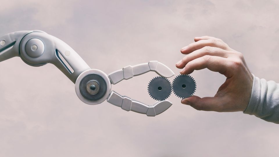 An image of a robot meeting a human hand.