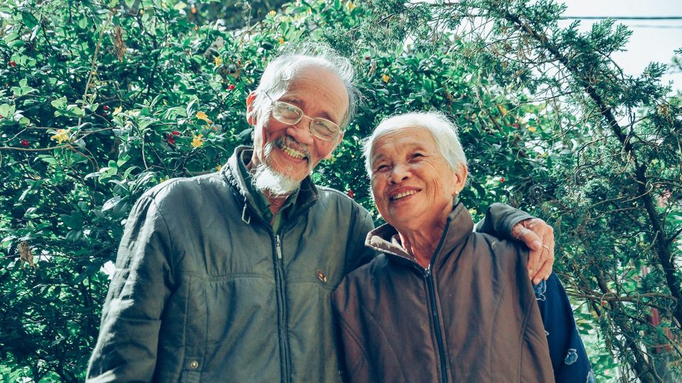 An old couple smiling. 