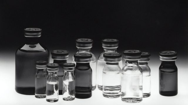 An array of glass bottles in different sizes. 