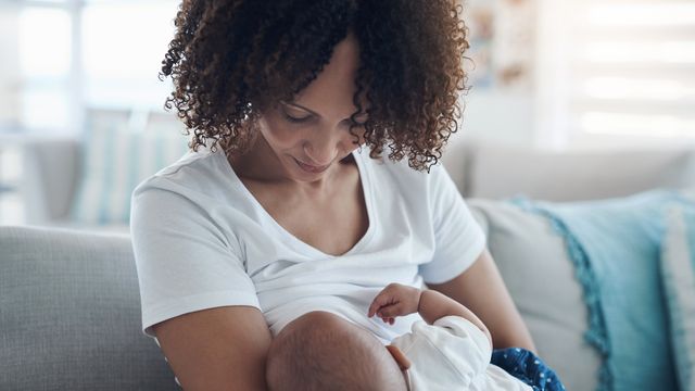 A mother breastfeeding. 