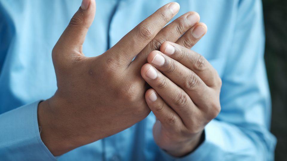 A close up of an individuals hand.