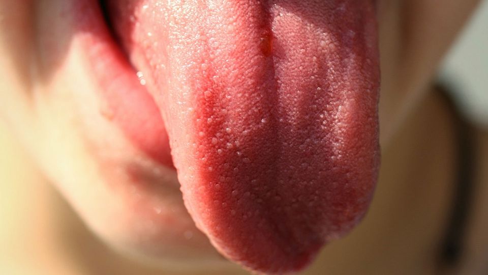 A person sticking their tongue out.