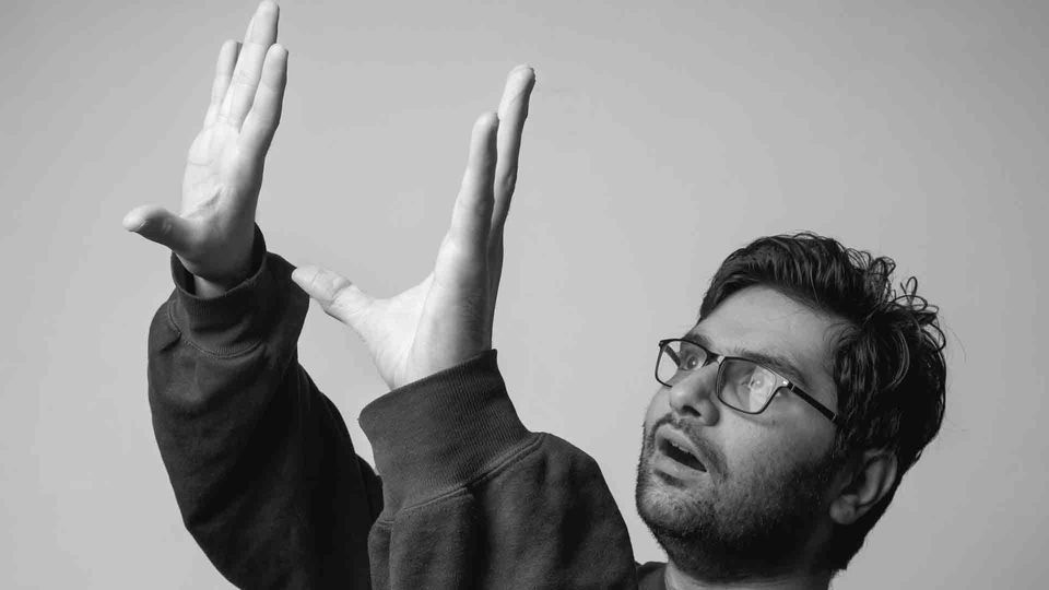 A man gesturing with his hands.