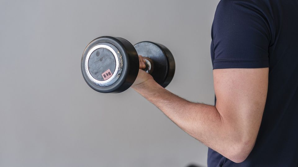 A man performs a bicep curl