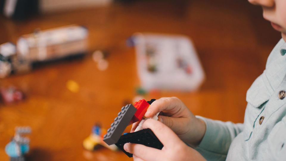A child playing with lego.