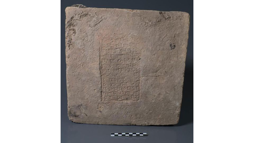 A brick engraved with shapes.
