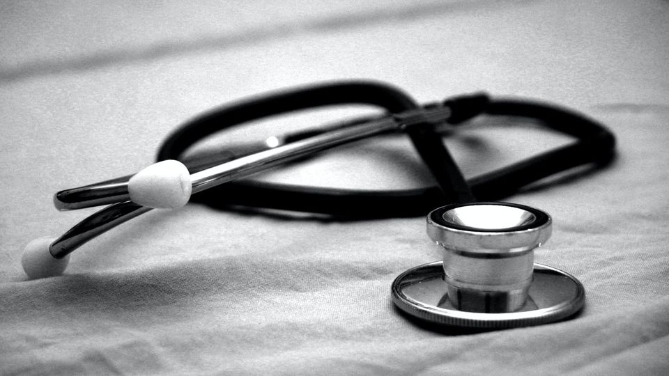 A stethoscope on a sheet.