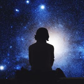 A person looking up to the sky. 