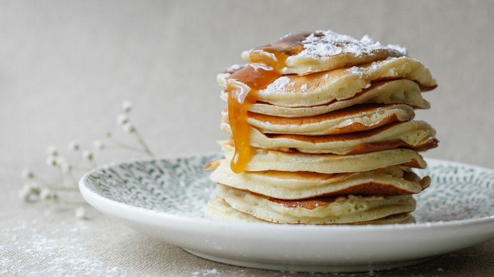 Pancakes stacked on a plate.