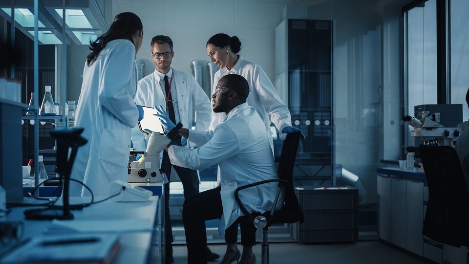 A group of scientists discussing.