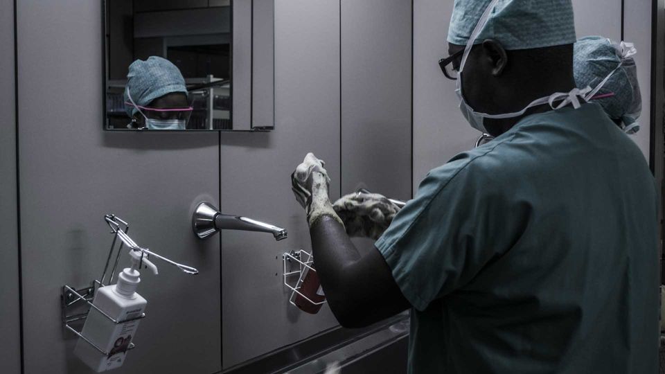 Two medical professionals washing their hands.
