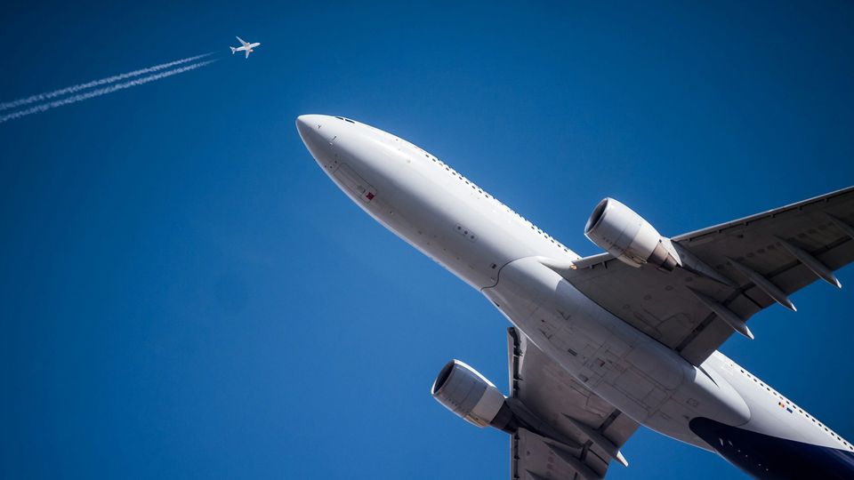 Two aircrafts flying in the air.