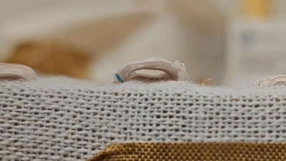 A fabric-based pressure sensor created using triboelectric materials and embroidery.
