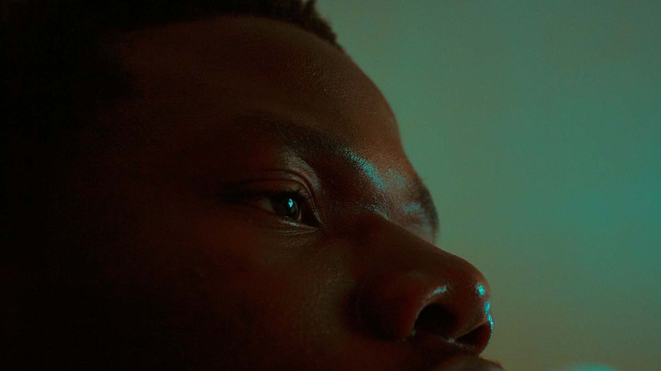 A close up of a mans face.