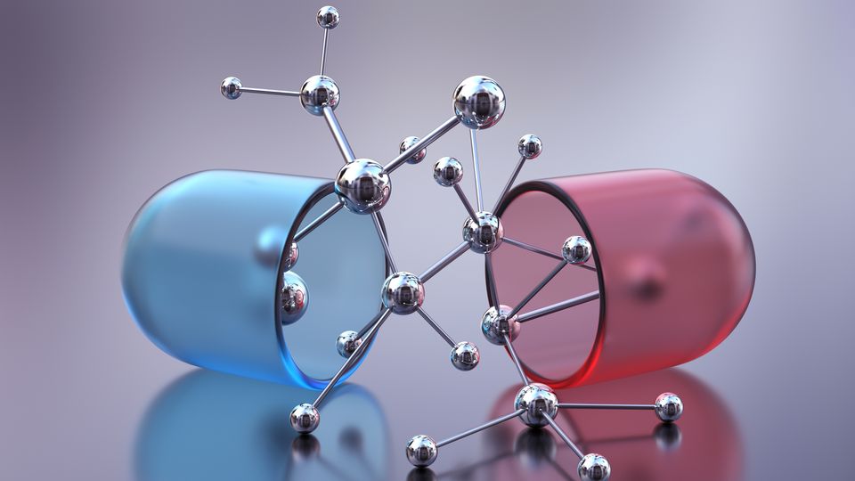 A red and blue capsule split in half.