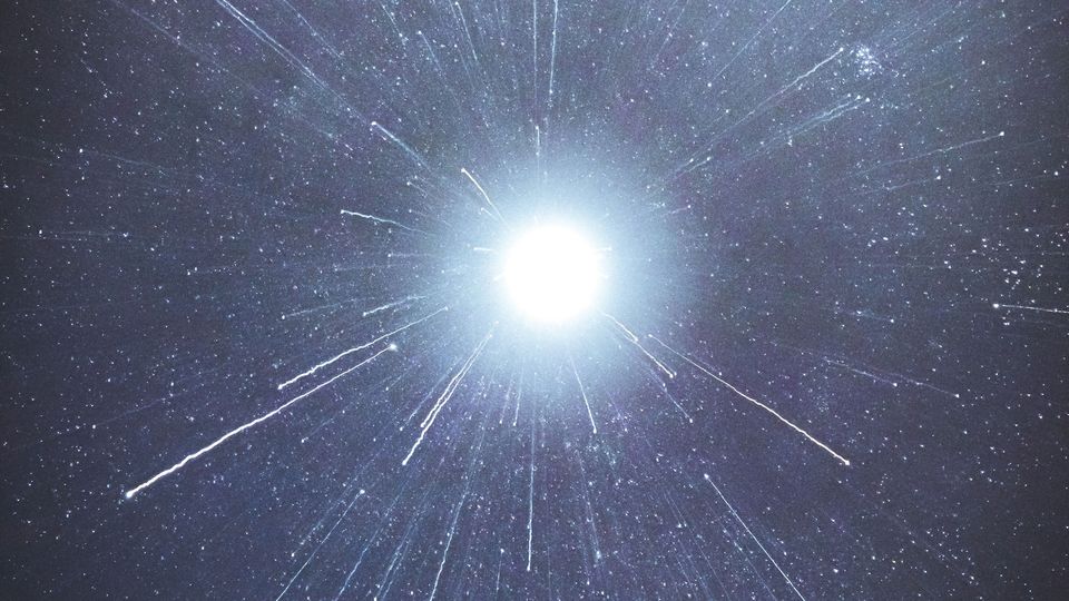 A bright light, with streaks of light coming from it.