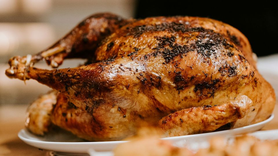 A roast turkey on a plate.