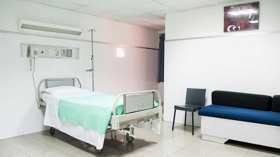 An empty hospital bed.