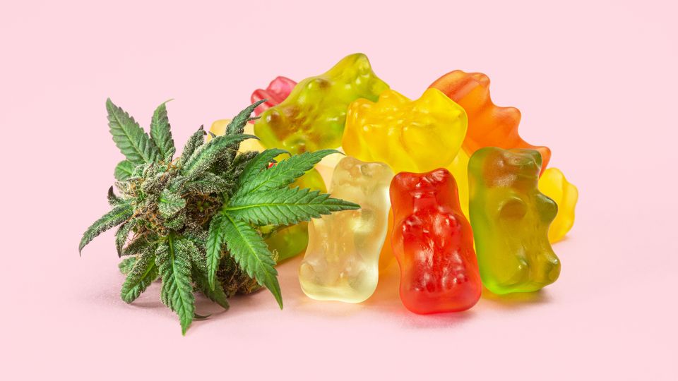 Gummies and cannabis leaves.