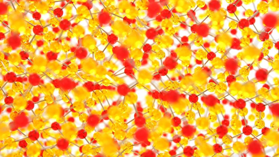 A lattice structure formed from red and yellow atoms.