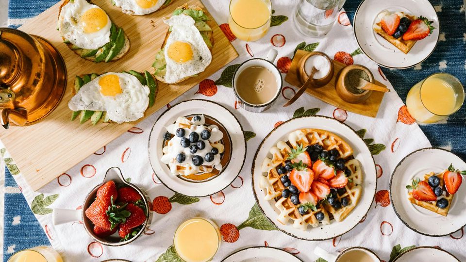 A table laid with various breakfast items.
