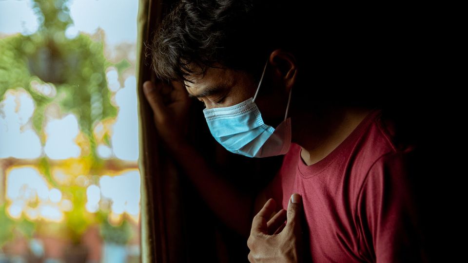 A man wearing a protective face mask.