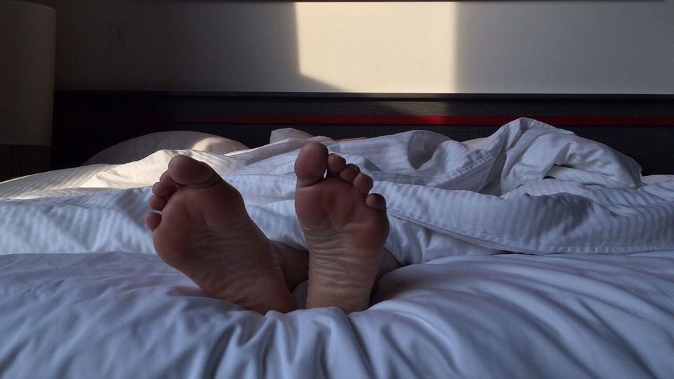Feet sticking out of bed covers