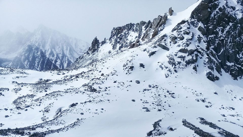 A rocky mountain covered in snow.
