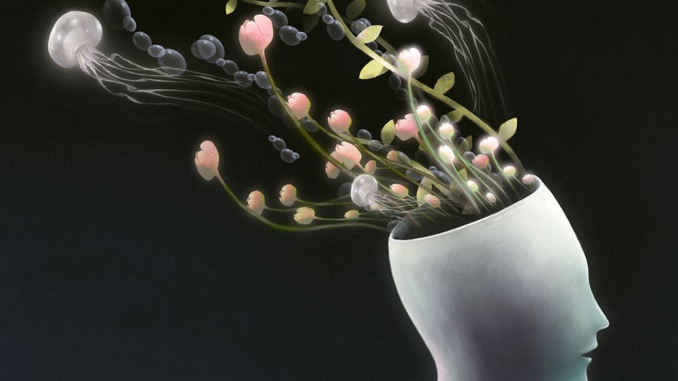 Jellyfish and flowers flowing out the top of a model of a head.