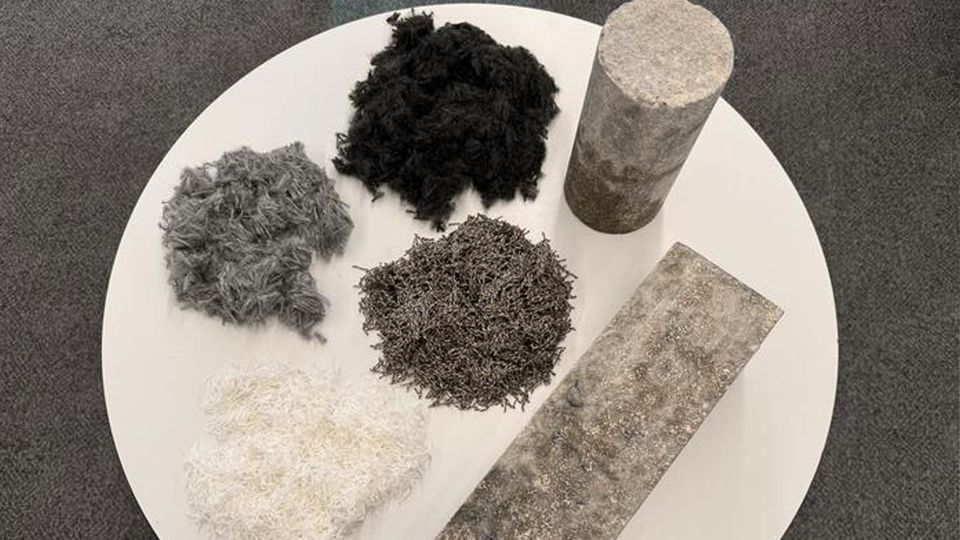 Samples of concrete and the carpet fibers used to create them.