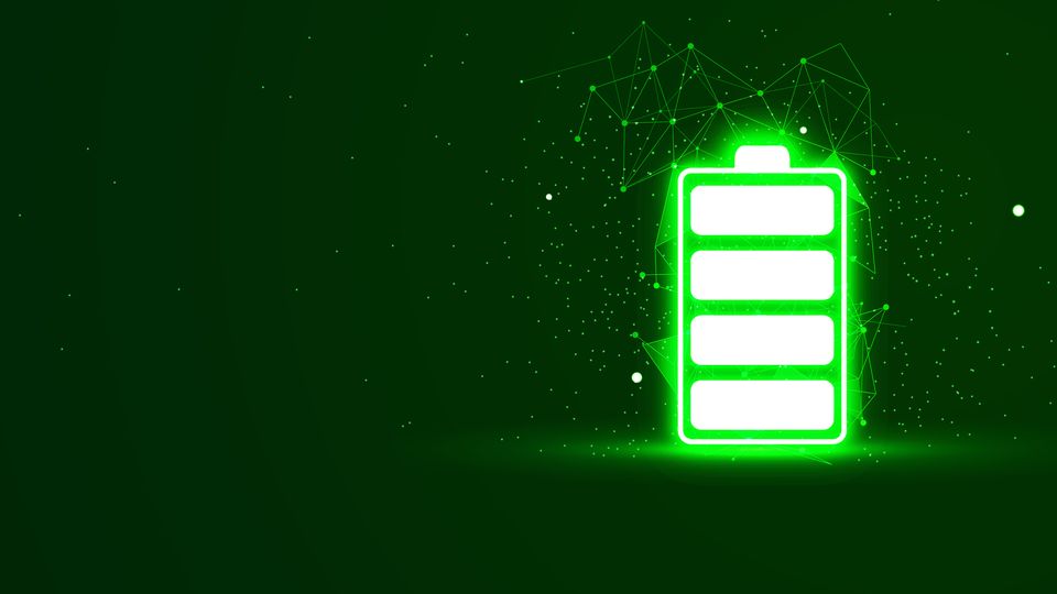 Bright green and white battery icon appearing to glow on a dark green background.