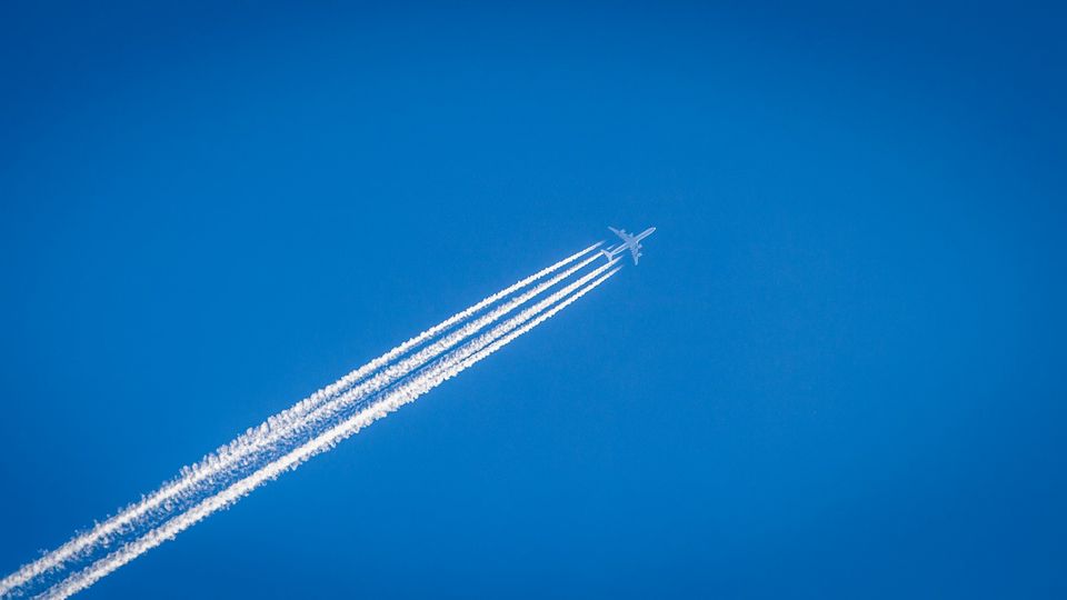 A plane flying in the sky.