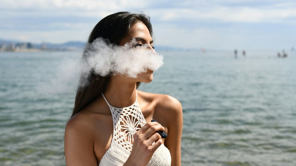 A woman vaping.