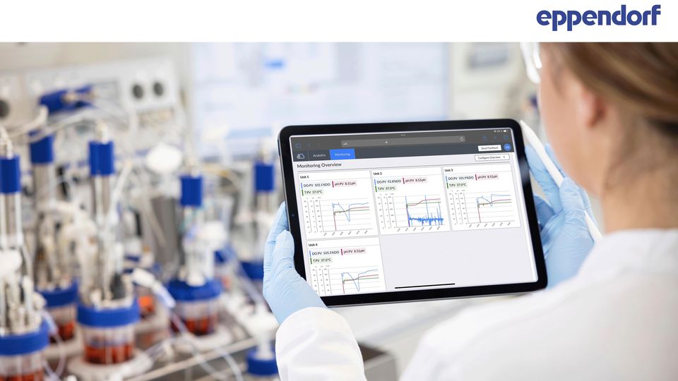 A scientist holding up an iPad.