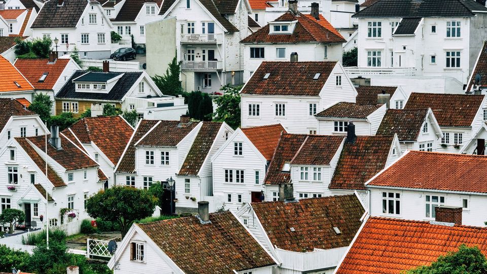 Image of lots of white houses with brown roofs. 