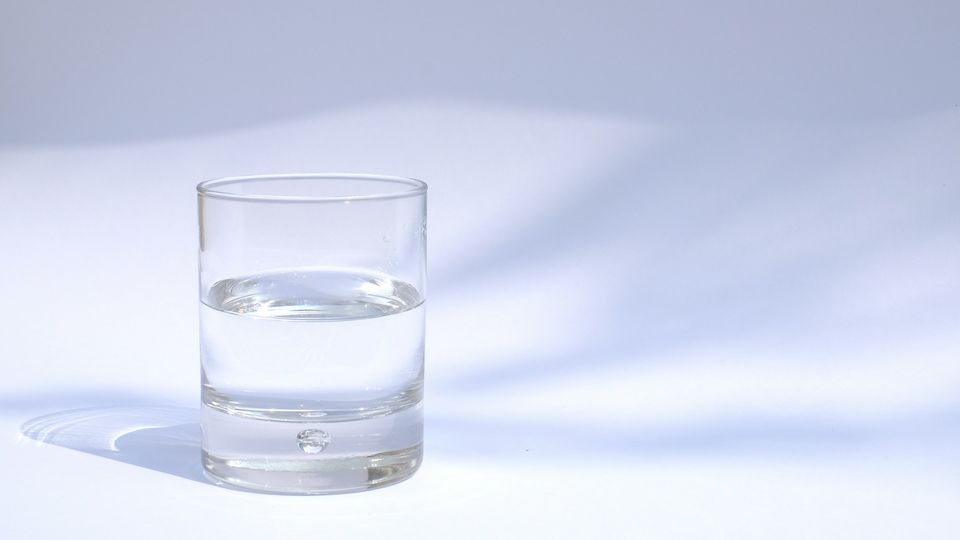 A glass of water representing the idea of a glass half full.
