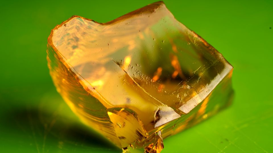 A block of yellow Jell-o with a chunk missing from the side.