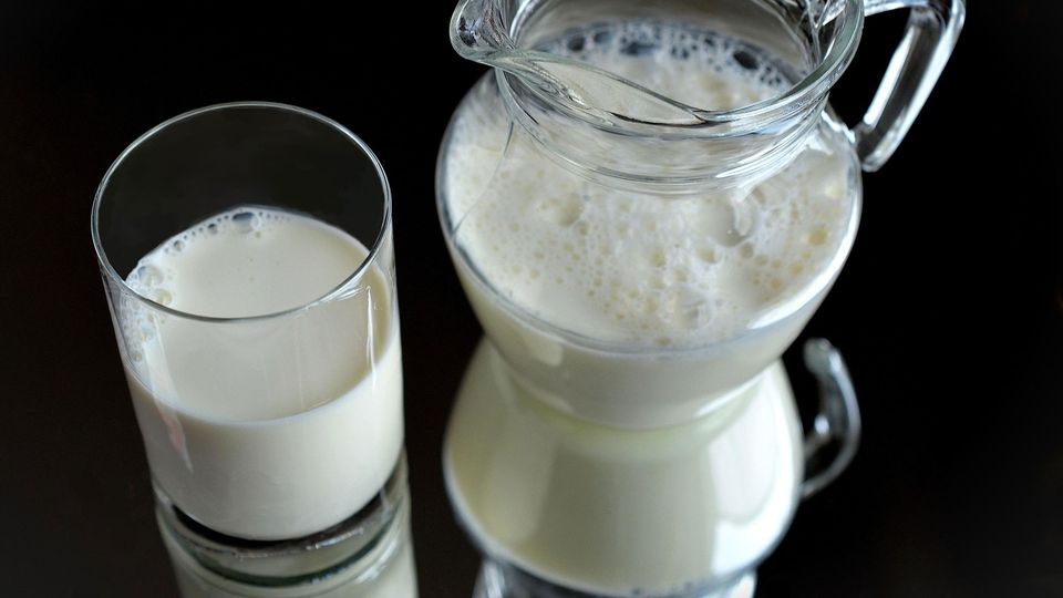Jug and glass of fresh milk.