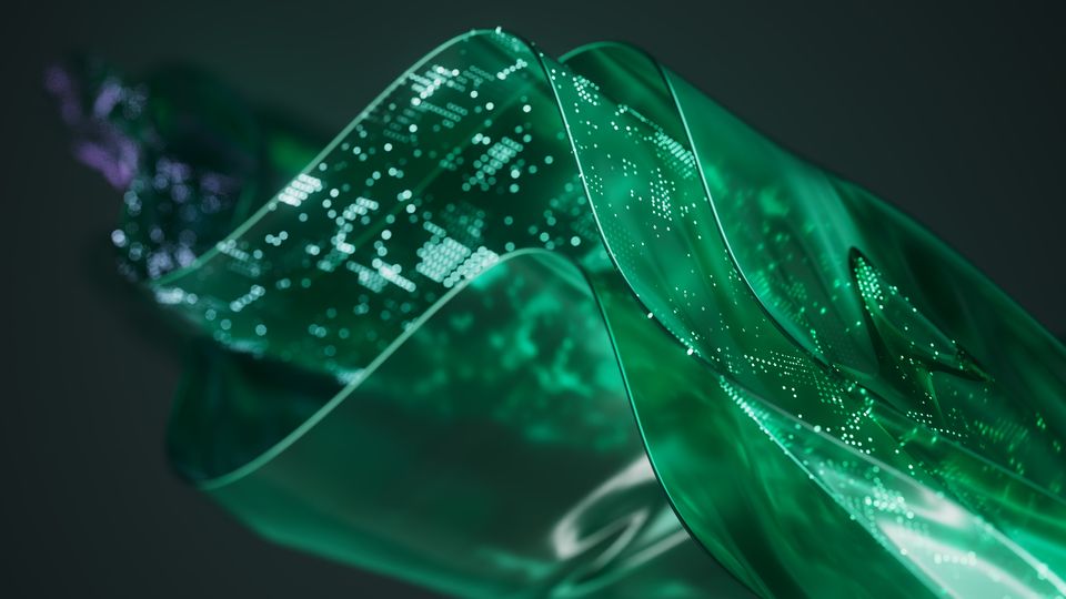 A digital illustration showing multi-layered plastic sheets, lit up in green and with little bright dots on them, as if the sheets were made of data.