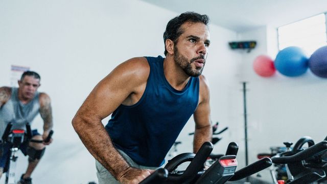 Man exercising on an exercise bike.