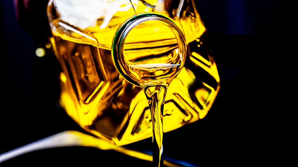 Seed oil being poured.